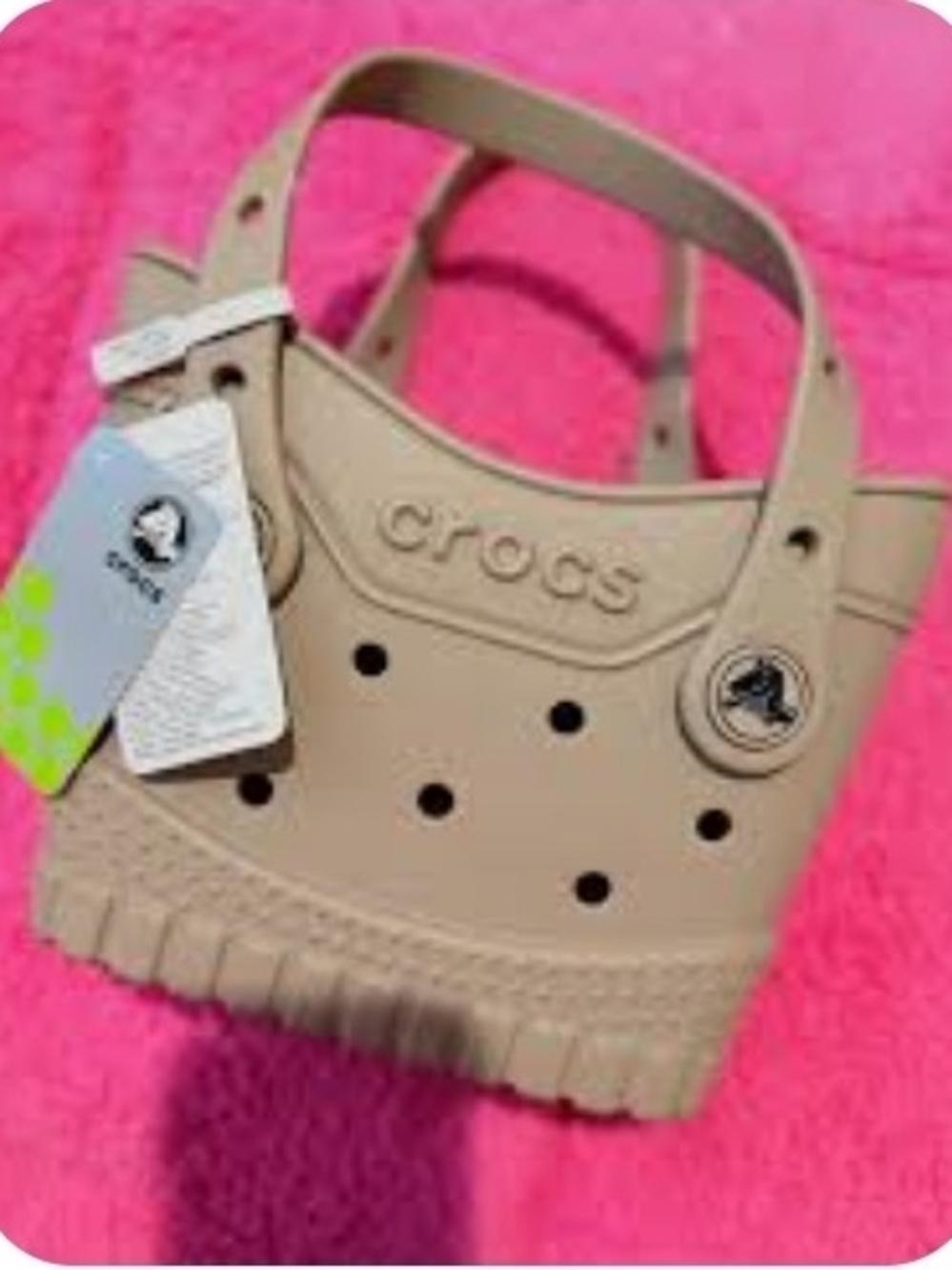 Small taupe Crocs bag.